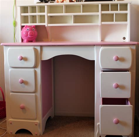The child with long chic hair and a beautiful body smiles charmingly. DIY DIVA: Lil PINK & White Desk Re-finished