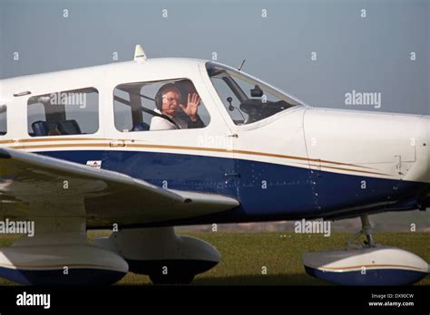 Pilot Waving From Light Aircraft At Compton Abbas Airfield Dorset In