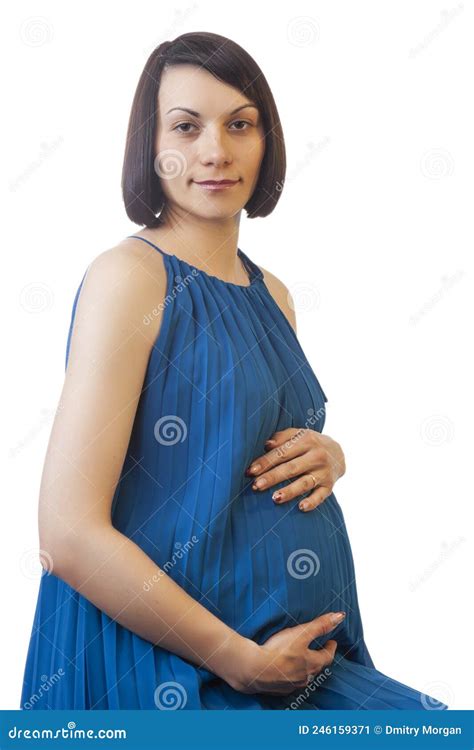 Caucasian Brunette Pregnant Woman In Light Long Blue Dress Posing Against Pure White Background