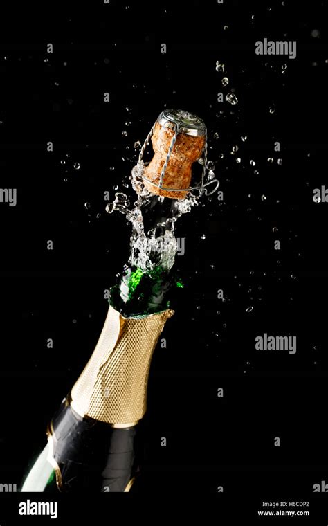 Bottle Of Champagne Exploding Isolated On Black Background Stock Photo Alamy
