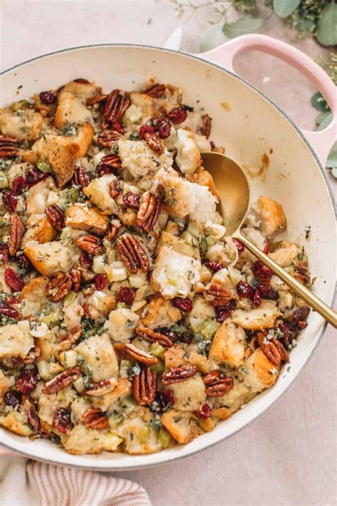 A Casserole Dish With Stuffing And Pecans In It Ready To Be Eaten