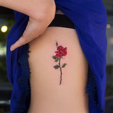 27 Inspiring Rose Tattoos Designs Rib Tattoo Coloured Rose Tattoo
