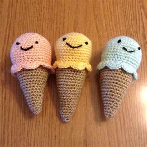 This pattern is a perfectly sweet addition to any girls bed or a cozy reading nook! Crocheted rattles - ice cream cones | Crochet, Knitting ...