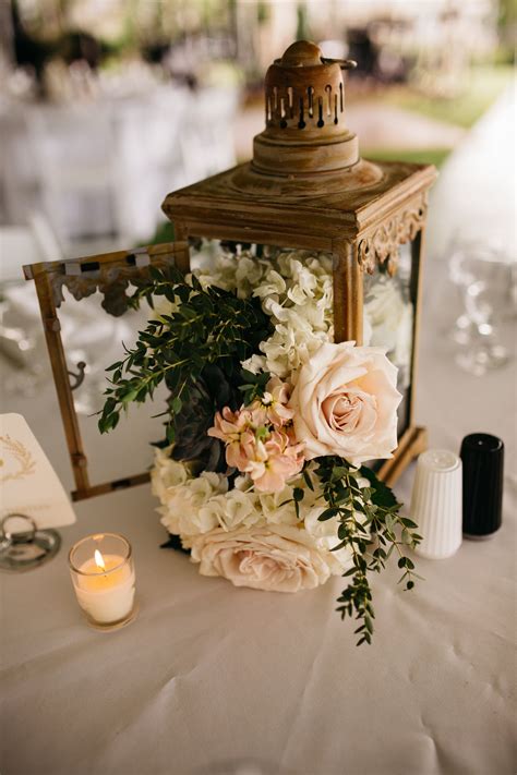 Amazing Lantern Centerpiece With Flowers Cascading Out View The Full