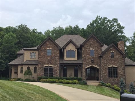 The entry foyer leads to a rotunda giving a dramatic flair to this spacious home plan as it opens to the rotunda with ceilings rising from 13' to 14'. Neutral Beige Exterior Brick Painting Upgrade: Before ...