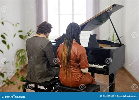 Young Couple Playing The Grand Piano Stock Photo Image Of Pianist