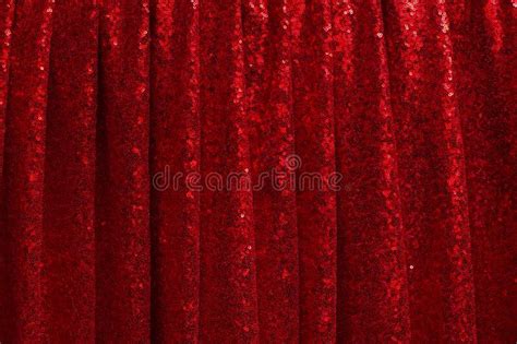Red Drapery Made Of Bright Shiny Fabric With Round Pleats Stock Photo