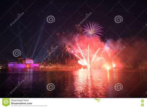Red And Purple Fireworks Over The Grand Harbour Fort St Angelo Stock