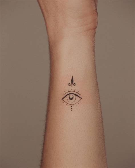 Fine Line Evil Eye Tattoo On The Wrist