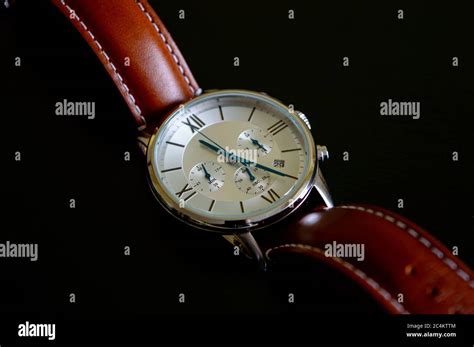 Nice Luxury Mans Wrist Watch With Blue Clock Hands And Brown Leather