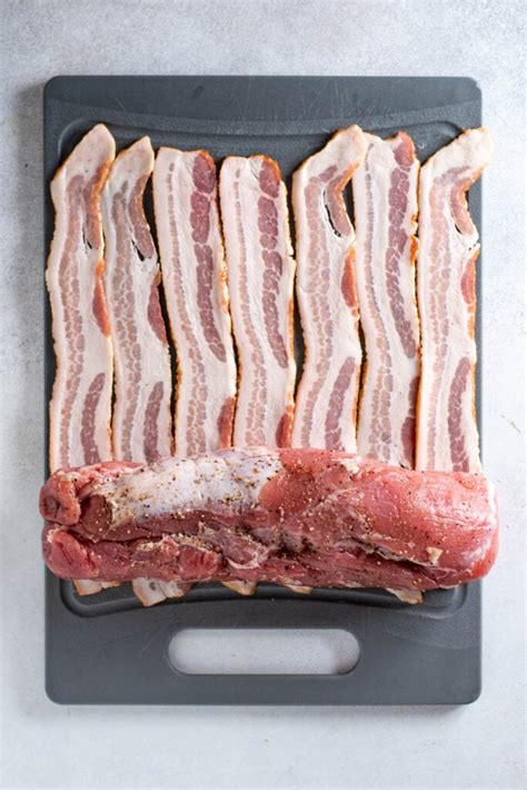 1.set your oven to 350 degrees f 2.cover with aluminum foil 3.cook for three hours 4.if you like your roast to look nice and brown take off the tin foil for a few minutes before you take it out of the oven. Bacon-Wrapped Pork Tenderloin Recipe | Kitchen Swagger