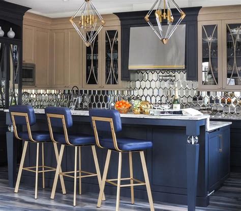 Blue Leather Counter Stools Sit At A Black Kitchen Island Boasting A