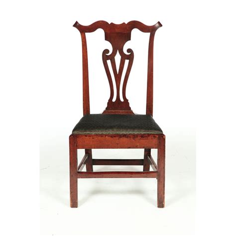 Marble decorates the acrylic side table top. CHIPPENDALE SIDE CHAIR.