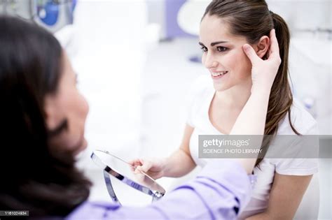 Dermatologist Examining Patients Skin High Res Stock Photo Getty Images