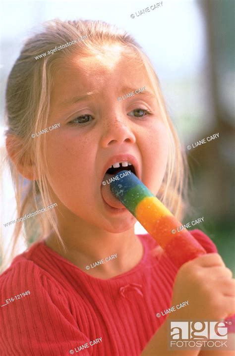 Young Girl Enjoying Popsicle Stock Photo Picture And Rights Managed