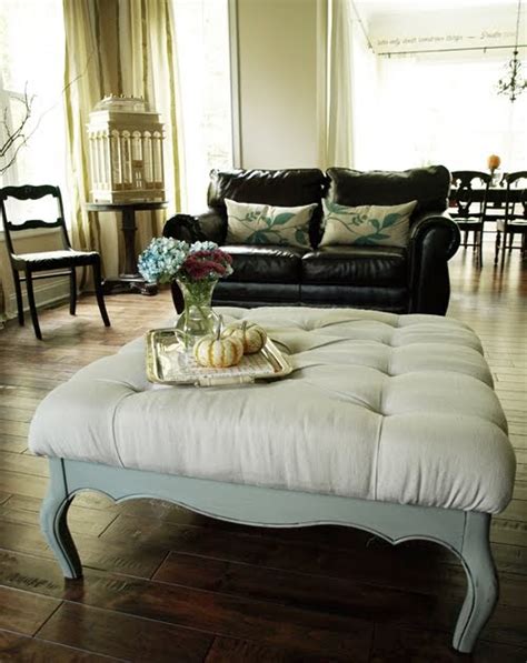 A coffee table functions as a space's focal point, anchoring sofas, club chairs, or loveseats around its perimeter. View From My Front Porch: DIY Coffee Table Ottoman