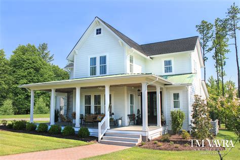 Youll Feel Right At Home In This Classic American Farmhouse This Design Features A Detached