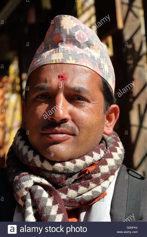 Portrait Of A Nepalese Man Wearing Dhaka Topi Traditional Nepalese Hat