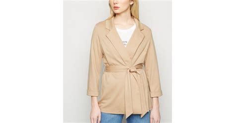 For the 2020 holiday season, returnable items shipped between october 1 and december 31 can be returned until january 31, 2021. Camel Belted Oversized Jersey Blazer | New Look