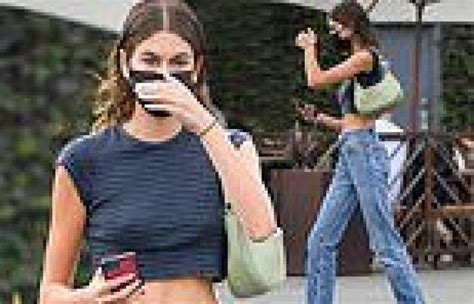 Kaia Gerber Flashes Her Toned Midriff In A Grey Striped Crop Top And Jeans In La