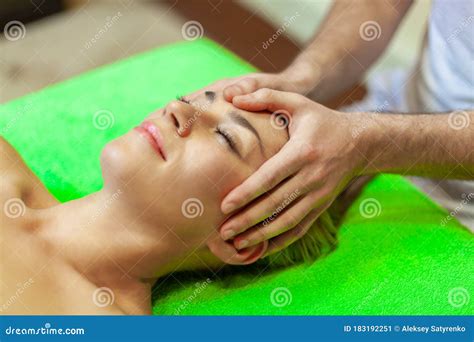 Close Up Of Beautiful Young Woman Relaxing With Face Massage At Beauty Spa Stock Image Image