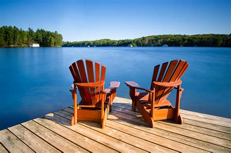 Adirondack Chairs On A Wooden Pier Stock Photo Download Image Now