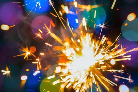 Sparkler On A Colorful Color Background Happy New Year Stock Image