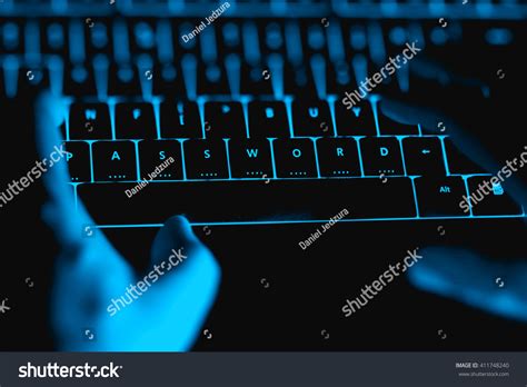 Hacker Typing On Illuminated Keyboard By Stock Photo 411748240