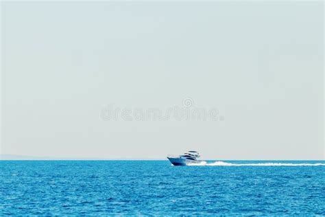 Luxury Motor Boat Cruising In Blue Sea Summer Vacation Stock Photo