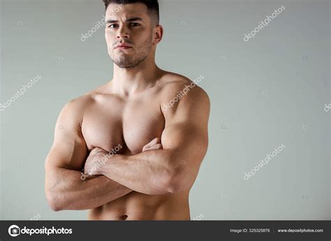 Sexy Muscular Bodybuilder Bare Torso Posing Crossed Arms Isolated Grey