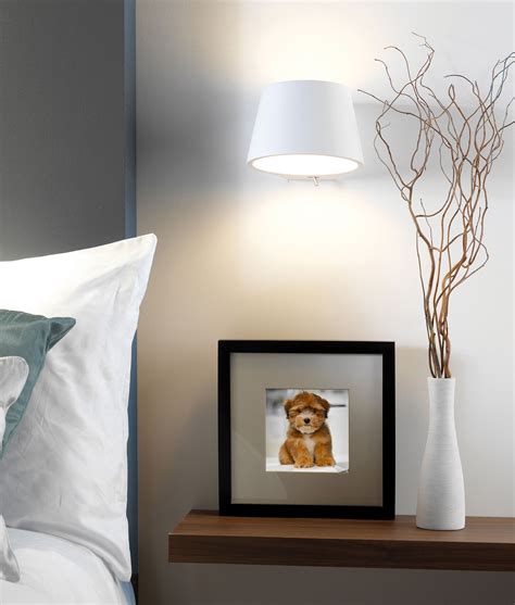 This wall sconces lighting has a fixed base, a metal lampshade and a copper lamp handle. Bedside Wall Light in Natural Plaster with Switch