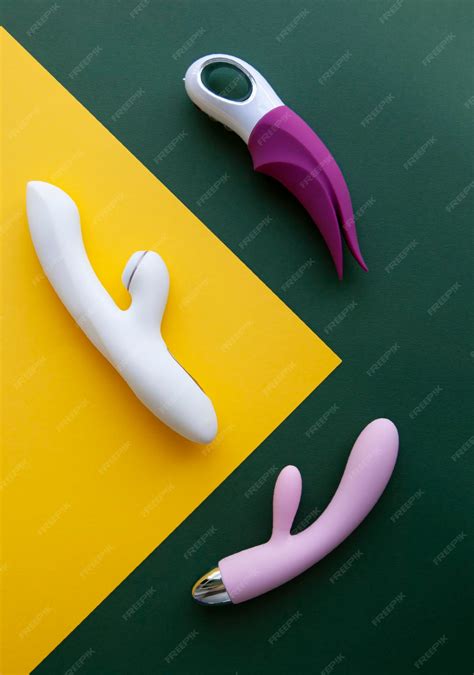 premium photo collection of different types of sex toys on a green and yellow background sex