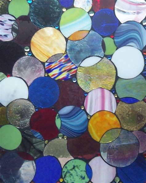 An Assortment Of Different Colored Glass Discs