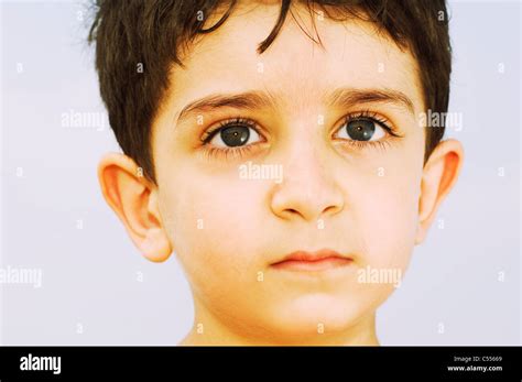 Sad Little Boy Looking Away Stock Photo Alamy