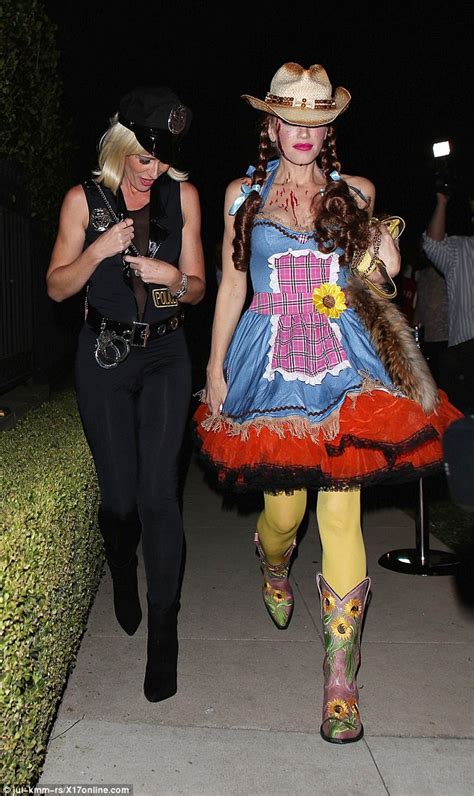 gwen stefani in a sexy cowgirl costume for george clooney s halloween party daily mail online