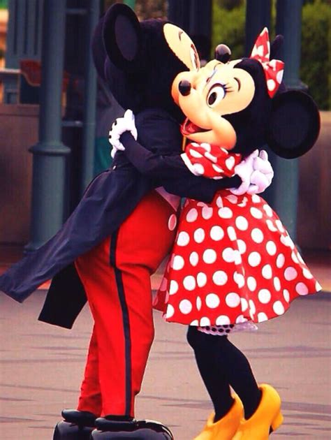 Mickey And Minnie Giving Each Other A Hug Disney Friends Walt Disney