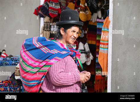 Native Bolivian Woman Wearing Traditional Dress And Bowler Hat In