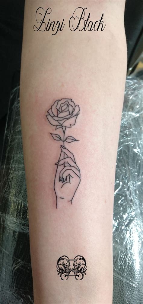 A tiny black rose tattoo in the middle of the right arm. Linzi+-+hand+holding+rose.jpg (1000×2120) | Rose drawing ...