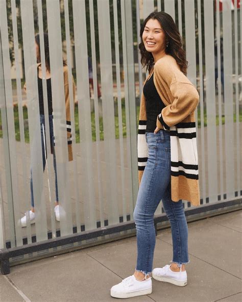 14 Outfits With White Sneakers We’re Falling For This November College Fashionista White