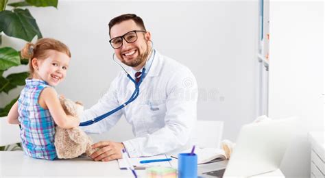 Friendly Happy Male Doctor Pediatrician With Patient Child Girl Stock