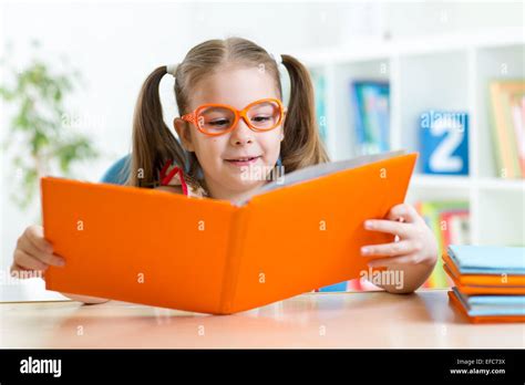 Little Girl Reading A Book Stock Photo Alamy