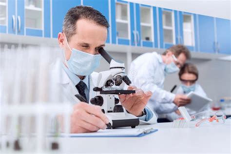 Scientist Working With Microscope Stock Image Image Of Research