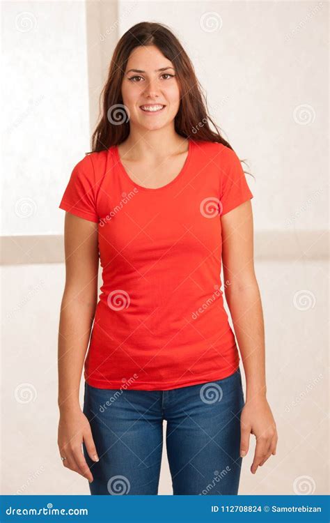 Beautiful Young Woman In Red T Shirt Over White Background Stock Photo