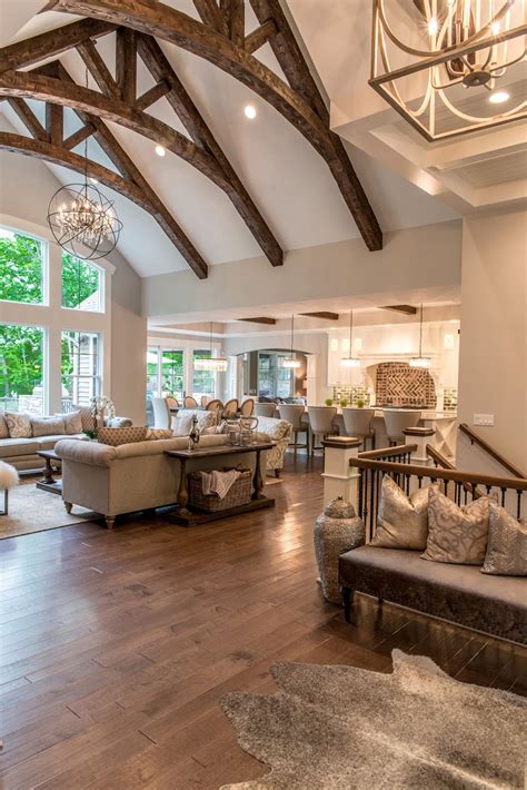 A large great room featuring a stunning vaulted ceiling and classy hardwood flooring. 10 Reasons to Love Your Vaulted Ceiling