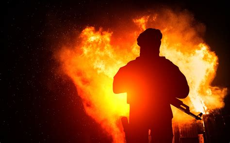 Free Photo Armed Man With Background Explosion Action Protection