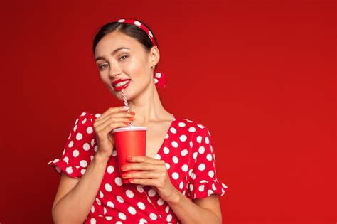 Premium Photo Cheerful Brunette Pin Up Girl Holding Soft Drink