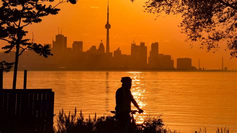 Download Wallpaper 2560x1440 Silhouette City Buildings Sunset Sea