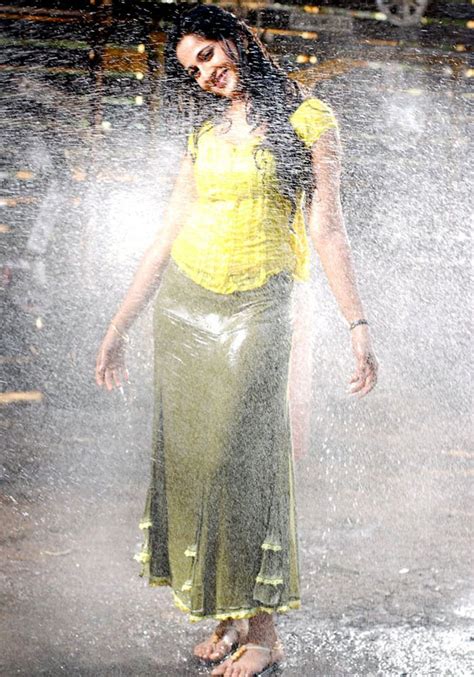 Indian Actress Anushka Shetty Hot Stills In Wet Yellow Dress