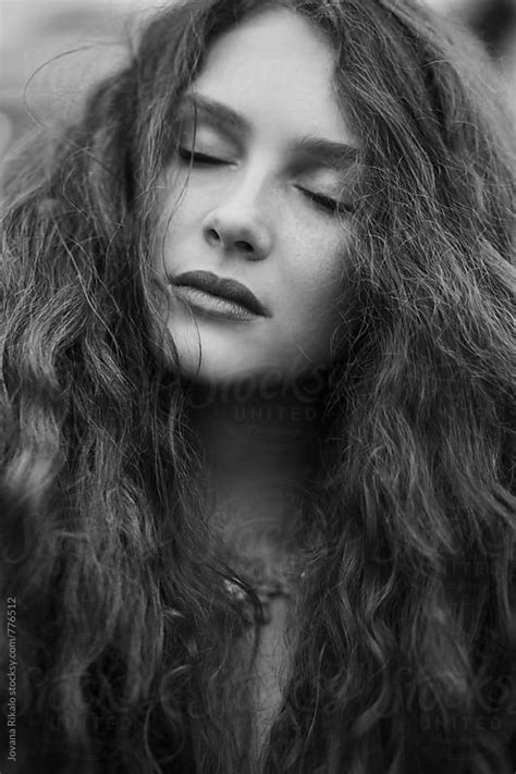 Black And White Portrait Of A Beautiful Young Woman With Freckles By