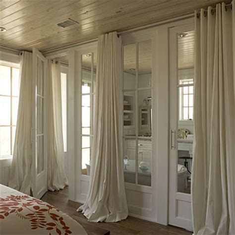 Sheer white curtains hung at ceiling height (rather than at the top of the window frame) create vertical scale. Floor To Ceiling Curtains Design Ideas